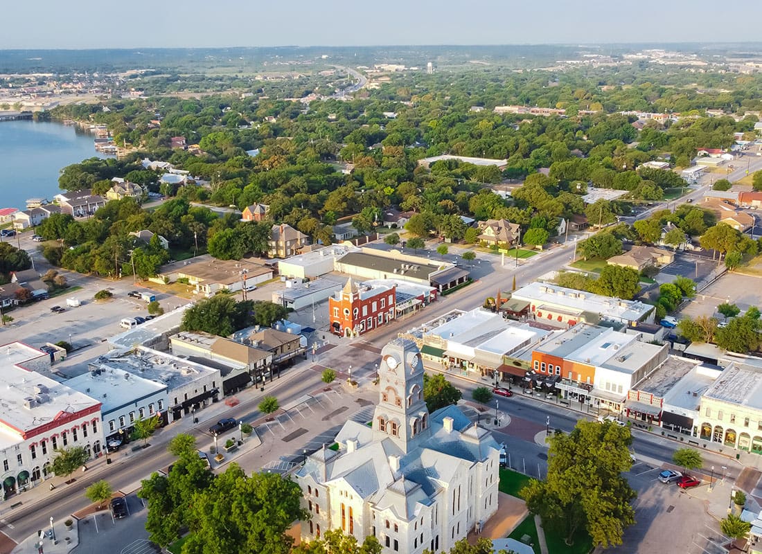 Granbury, TX - Aerial View of Granbury, TX With Trees and a Lake